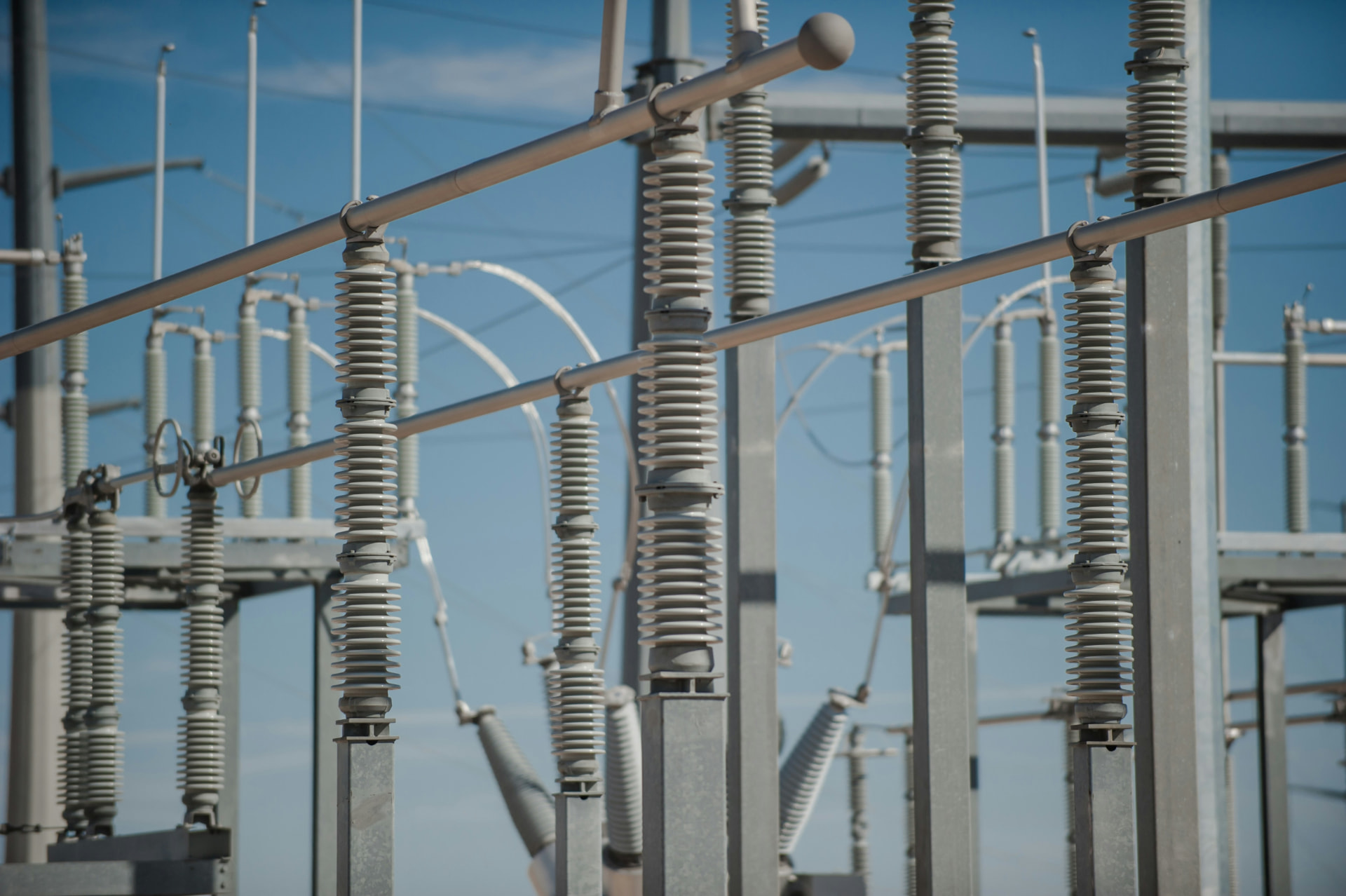 High-voltage buswork and insulators in an outdoor substation